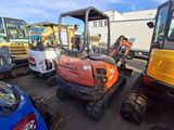 many different types of construction equipment in a parking lot
