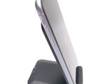 a cell phone that is sitting on top of a stand