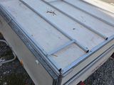 an image of a trailer with a metal door on the back
