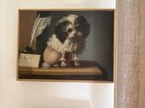 a painting of a dog sitting on a shelf next to a painting of a dog