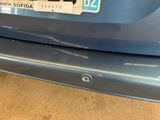 a close up of a car ' s license plate on the back of the car