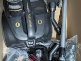 a box with a vacuum and other items inside of it