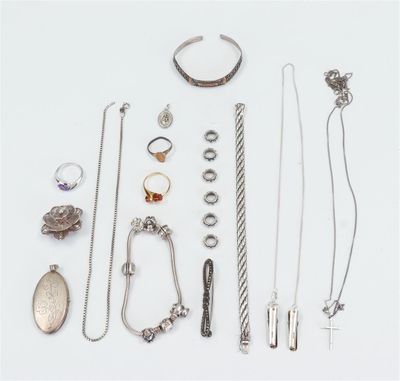 an assortment of silver jewelry including rings, bracelets, rings, and other items