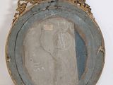 a picture of a mirror that is hanging on the wall