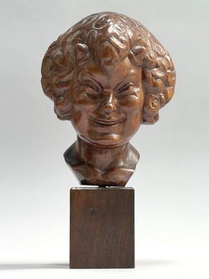 a bronze bust of a woman with curly hair on a wooden base