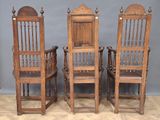 three wooden chairs are sitting next to each other on a wooden floor