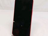 a cell phone that is on a stand on a table