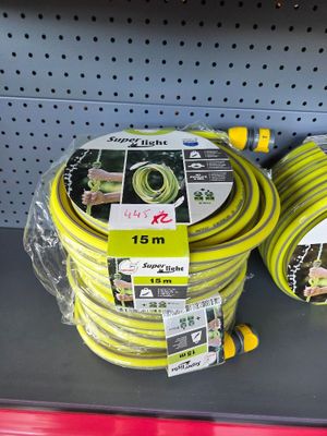 yellow garden hoses are on display in a store for sale