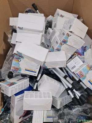 a cardboard box full of electronic equipment in it