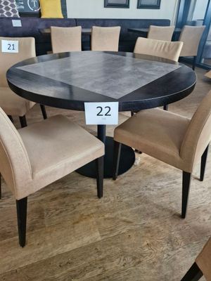 a table and chairs in a store with a price tag on it