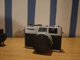 a small camera sitting on a table next to a camera