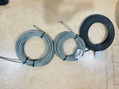 three wires are laying on the floor next to each other