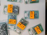 many different types of screws and screws on the table