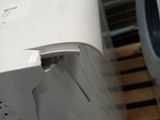 a close up of a washing machine and a dryer on a pallet