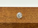 a close up of a diamond sitting on top of a wooden box