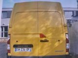 a picture of a yellow van parked on the side of the road