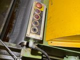a close up of a machine that is working on a piece of metal
