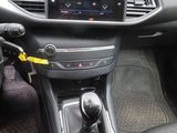 a dashboard of a car with a steering control
