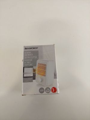 the box of a microwave is open on a white surface