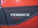 a close up of a red and black car with a fenwick logo on it