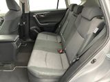 the back seats of a car with a remote control in it