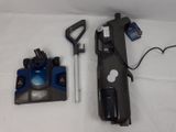 a blue and black vacuum and a black and white vacuum