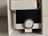 a white box with a black and white clock inside of it