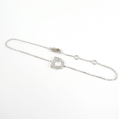 a white gold and diamond bracelet with a heart charm