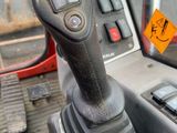 a close up of a car dashboard with a steering control
