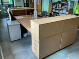 a wooden desk with a computer on it in a room