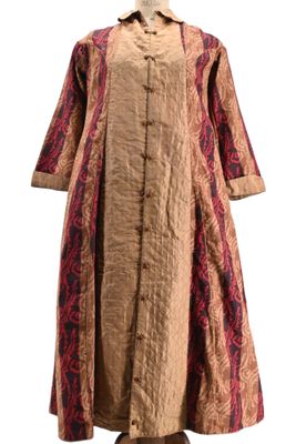 an image of a woman ' s dress on a mannequin stand
