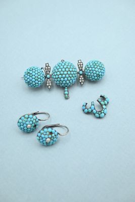 three pairs of turquoise beaded earrings and a pair of earrings