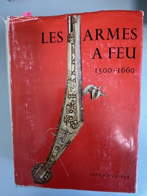 un vieux livre sur lequel figure l'image d'un couteau