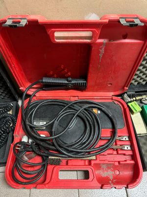 a red tool box with wires and other tools in it