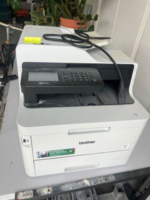 a printer that is sitting on top of a table