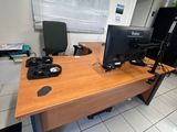 a desk with two monitors and a laptop on it