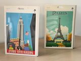 three postcards sitting on a table next to each other
