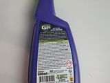 a close up of a bottle of cleaner on a table