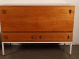 an image of a wooden chest of drawers in a room