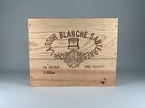 a wooden box with a logo on it sitting on a table