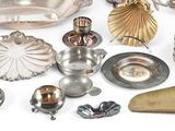 a lot of silver objects on a white surface