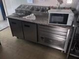 a microwave sitting on top of a counter in a kitchen