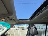 a view of the sunroof from inside of a car