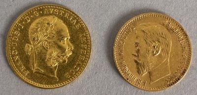 two gold coins with a portrait of a man and a woman on them