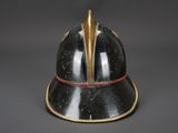 an old helmet with a gold spike sticking out of it ' s side