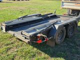 an image of a flatbed truck parked in a field