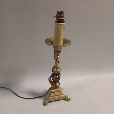 a lamp that is on a table with a light on top of it
