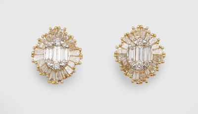 a pair of diamond and gold earrings
