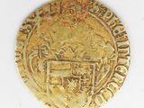 an image of a gold coin with a coat of arms on it