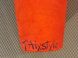 an orange cup with the word frixstyle written on it